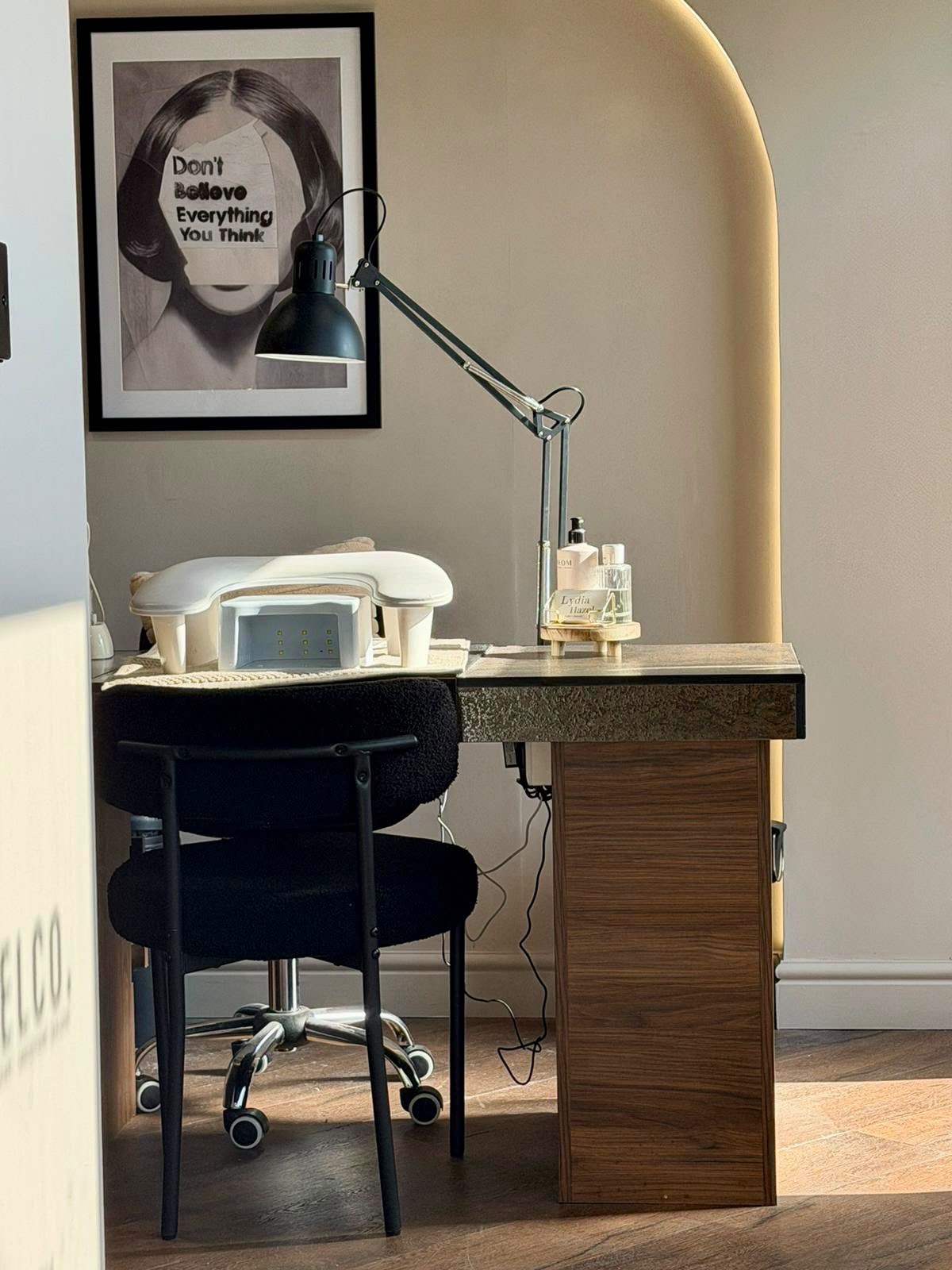 Salon workstation set inside an arched alcove with concealed LED